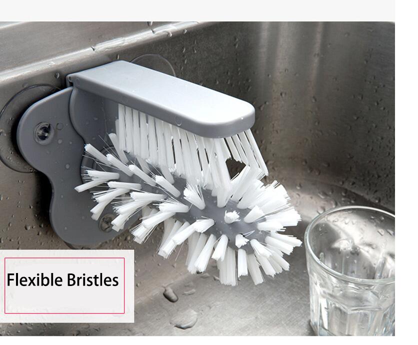 A gray suction cup brush for the kitchen, measuring approximately 17.5 by 14 centimeters. Made from PP+PVC materials, featuring a double-head design for effective cleaning